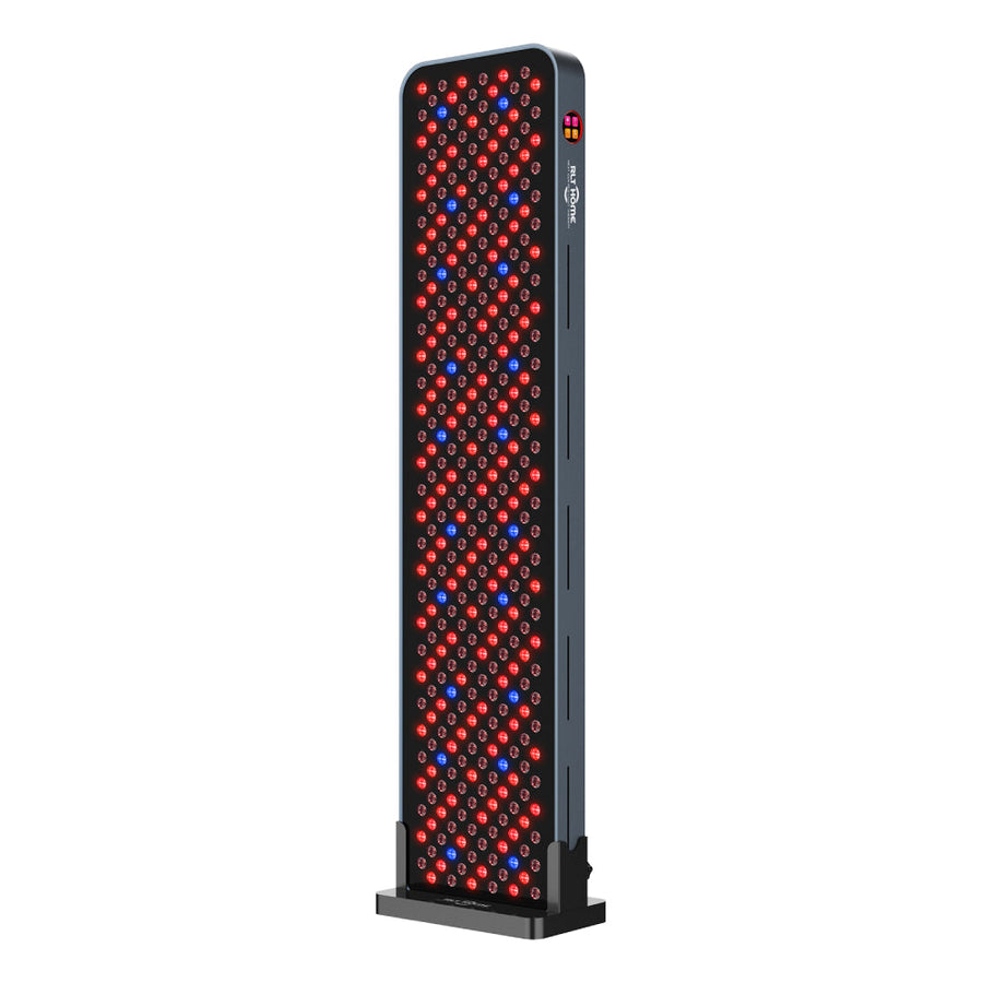 RLT Home Total Spectrum MAX red light therapy panel, front view with LEDs on, on its floor stand